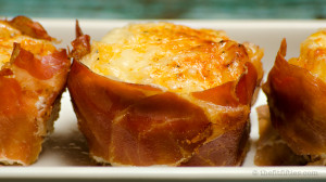 Prosciutto wrapped baked eggs